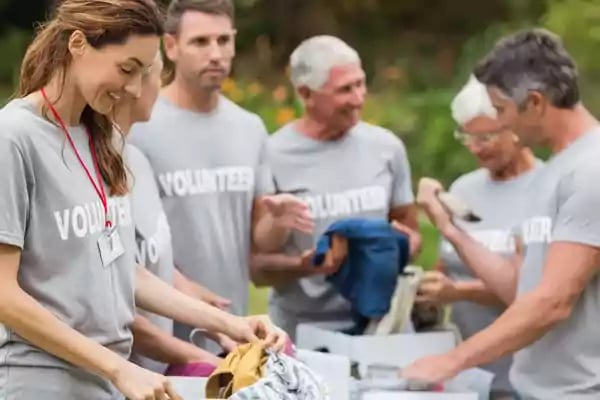 Volunteers sorting products.