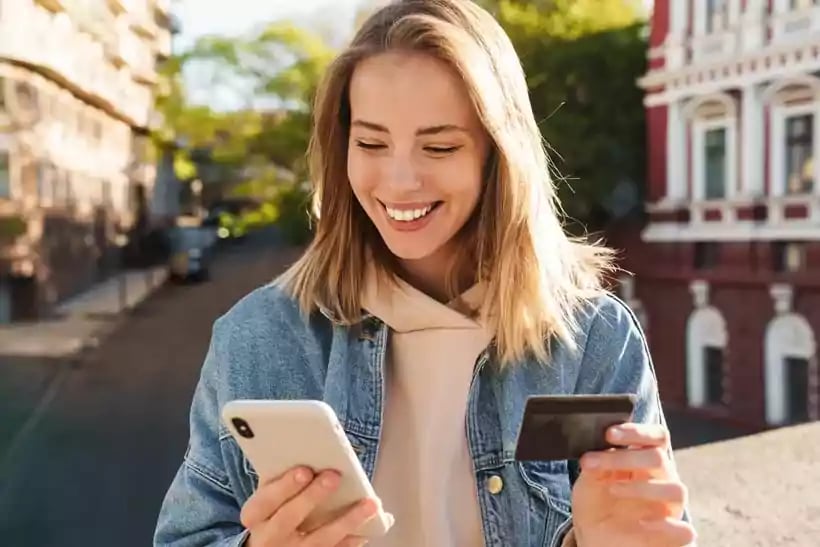 Smiling woman looking at her phone.