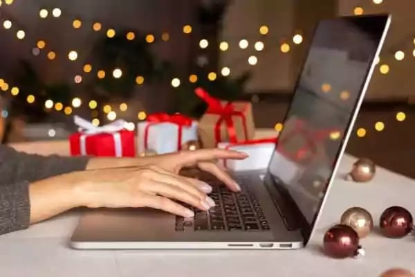 Woman typing on a laptop