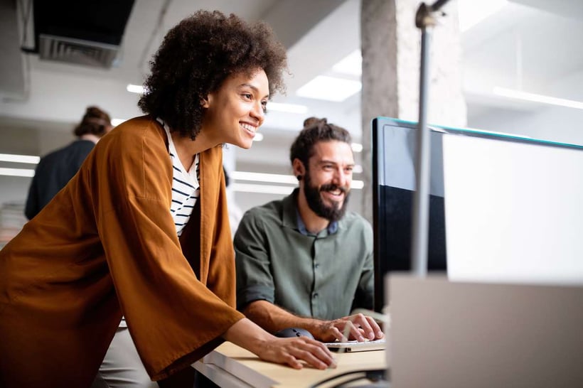 Man and woman on a computer