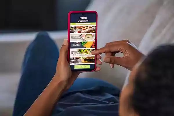 Food delivery app on a phone.