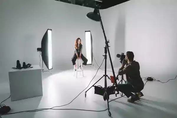 Photographer taking photos of a model.