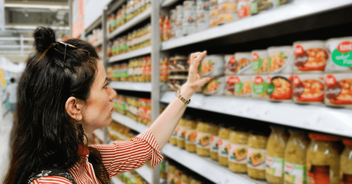 woman picking a product from a shelf