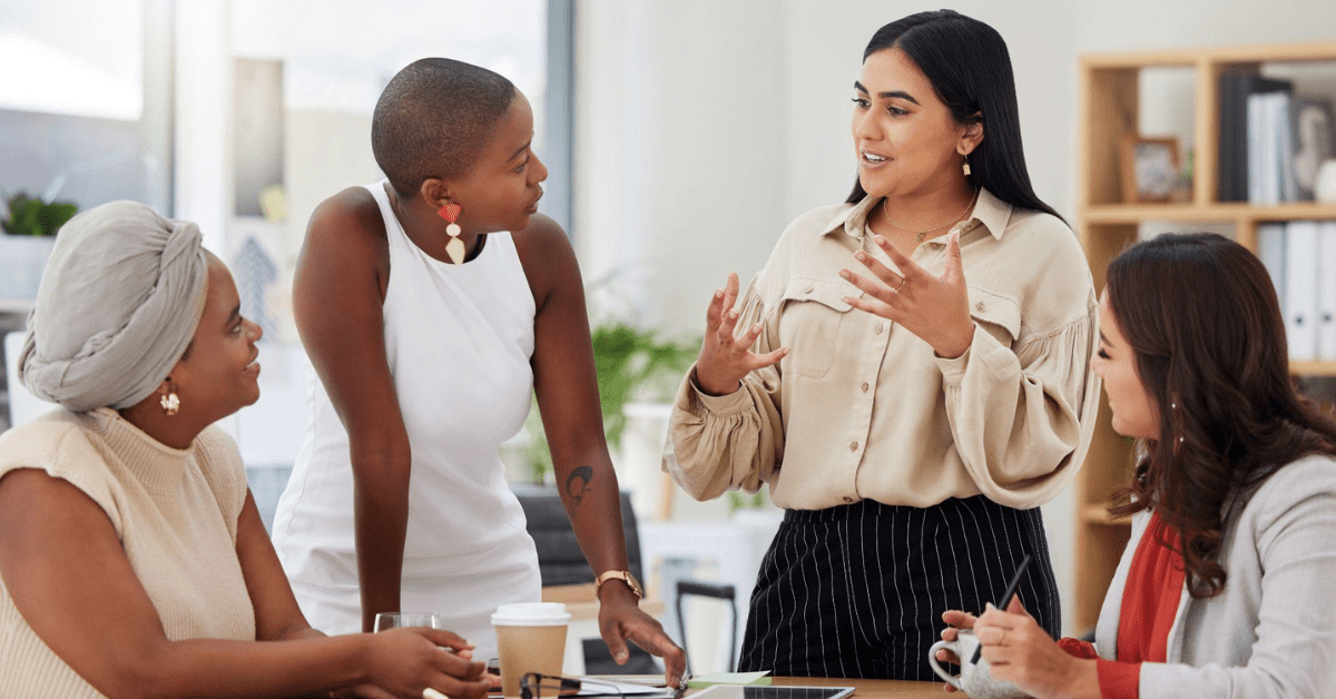 four women in a meeting