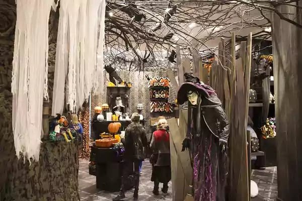 Halloween scene with a witch mannequin.