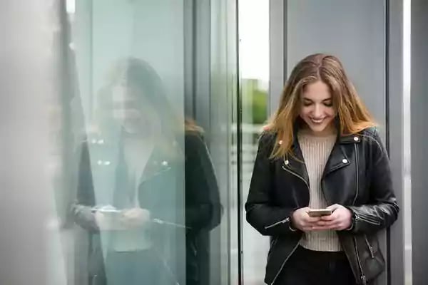 happy-leather-jacket-girl-with-phone