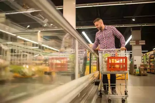 Man shopping in a grocery store.