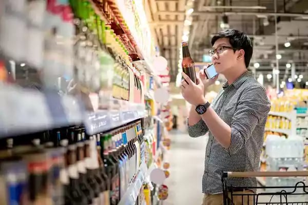 Man shopping in a liquor store.