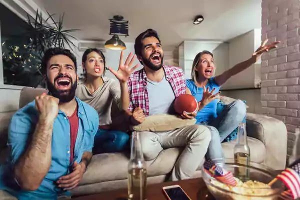 Group sitting together cheering.