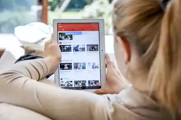 Woman shopping on a tablet.