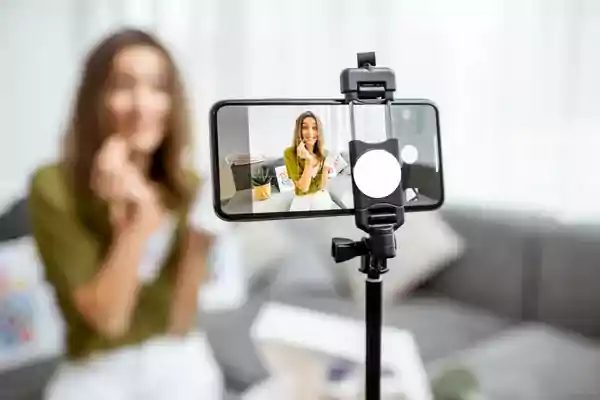 Woman recording her vlog about healthy eating on a phone screen.