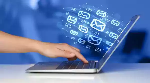 Sending an email campaign using a laptop computer.