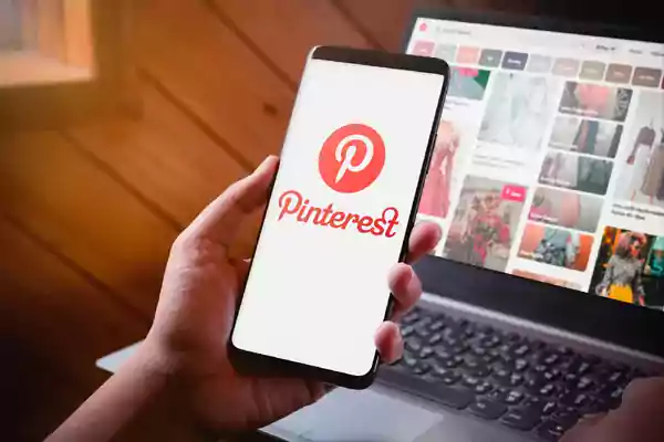 Mobile phone with the Pinterest app on display.