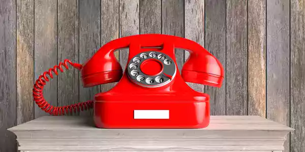 Red rotary dial phone.