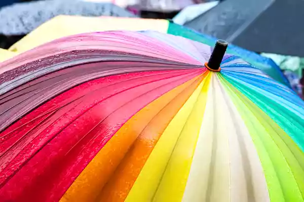 Rainbow colored umbrella.